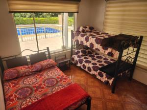 Una cama o camas en una habitación de Finca Villa Esperanza