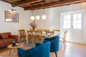 a living room with a table and chairs at Gabri Guesthouse Transylvania in Aita Seacă