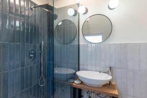 a bathroom with a sink and a mirror at Gabri Guesthouse Transylvania in Aita Seacă