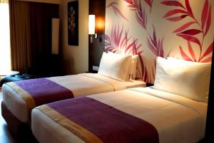 Postel nebo postele na pokoji v ubytování Purple Palms Resort & Spa