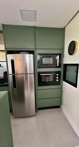 Una cocina o cocineta en Alto Padrão e Tranquilidade no Litorial Norte