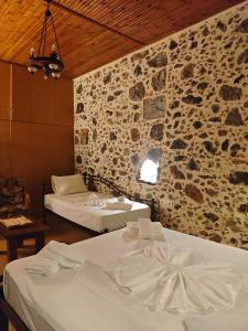 Ένα ή περισσότερα κρεβάτια σε δωμάτιο στο Elgina Apartments 1 Rethymno