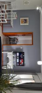 a desk with a laptop computer on top of it at 57m2, quarto casal, colchonete extra, super arejado in São José +5 photos