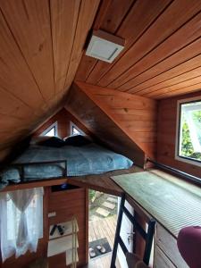 an inside view of a cabin with a ceiling at Mini House Park in Campo Alegre