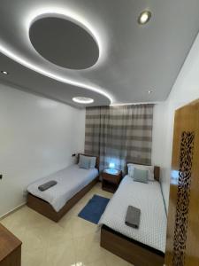 Postel nebo postele na pokoji v ubytování bel appartement + 5 fotografií