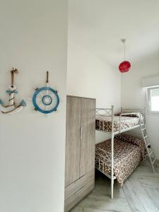 Postel nebo postele na pokoji v ubytování Cento Passi dal Mare