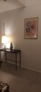 a room with a table and a picture on the wall at Villa Utsikten in Bø