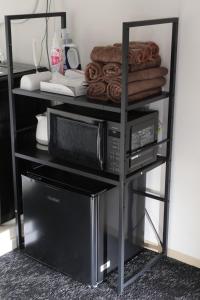 Ένα ή περισσότερα κρεβάτια σε δωμάτιο στο 森下ビル302 +4 φωτογραφίες