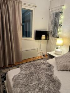 Ένα ή περισσότερα κρεβάτια σε δωμάτιο στο Havuille Lodge