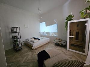 a room with two beds and a large window at Solaris Home Spa in Fiuggi