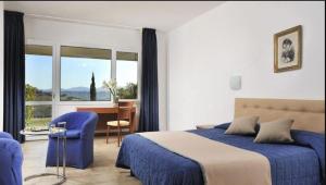 Ένα ή περισσότερα κρεβάτια σε δωμάτιο στο Relax Hotel Acquaviva - Tuscany Hills +52 φωτογραφίες