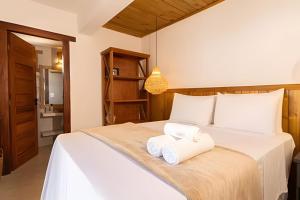 Ένα ή περισσότερα κρεβάτια σε δωμάτιο στο Rua do Mucugê | Sua suíte dos sonhos