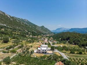 an aerial view of a house on a mountain at Villa Eden with heated pool in Omiš +43 photos