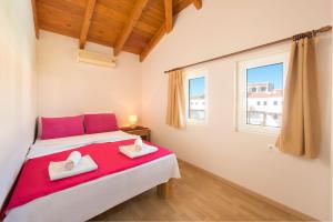 Voodi või voodid majutusasutuse Ferienhaus In Kolympia Mit Privatem Garten toas +8 fotot