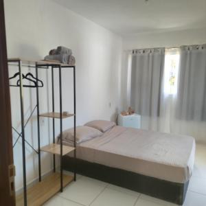 Postel nebo postele na pokoji v ubytování casa da tia Fabíola lugar de gente feliz