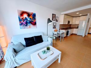 a living room with a couch and a table at Canary Dreams Ocean View in Playa del Cura