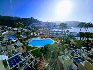 an aerial view of a resort with a swimming pool at Canary Dreams Ocean View in Playa del Cura