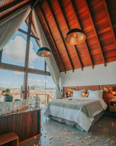 Ένα ή περισσότερα κρεβάτια σε δωμάτιο στο Chalés Laguna Alto Viçosa