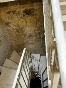 a spiral staircase in a building with a ceiling at Phi Home Bormla in Birgu