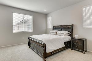 a bedroom with a bed and two windows at Near Hospitals Home with Pool Access in Temecula in Linda Rose +24 photos