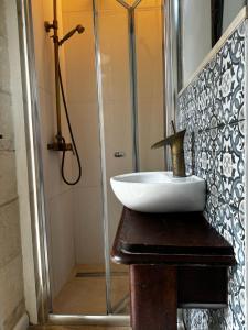 a bathroom with a sink and a shower at Phi Home Bormla in Birgu +7 photos
