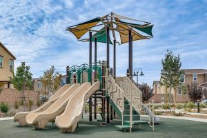 a playground with a slide at a park at Near Hospitals Home with Pool Access in Temecula in Linda Rose