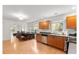 a kitchen and living room with a table and a dining room at New listing! The Terra Cotta Bungalow with Firepit in Athens