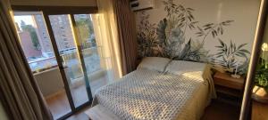 En eller flere senge i et værelse på Studio Bliss