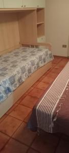 Postel nebo postele na pokoji v ubytování Appartamento a La Maddalena + 19 fotografií