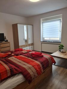 Voodi või voodid majutusasutuse Liebevolle Ferienwohnung In Zentraler Lage toas