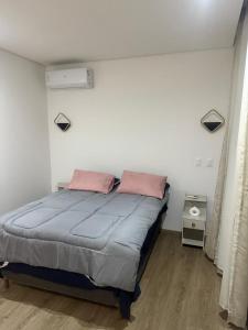 Ένα ή περισσότερα κρεβάτια σε δωμάτιο στο Casa com piscina no Reserva do Toque em Milagres