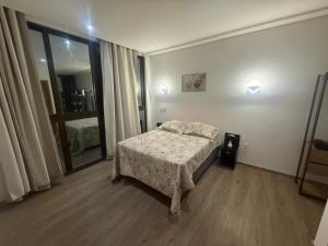 Ένα ή περισσότερα κρεβάτια σε δωμάτιο στο Casa com piscina no Reserva do Toque em Milagres +23 φωτογραφίες