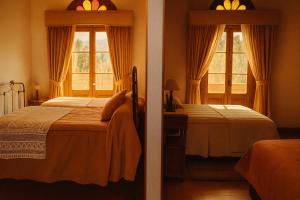 a bedroom with two beds and two windows at Hotel HALLEY & Vive la Magia del Valle de Elqui in Vicuña