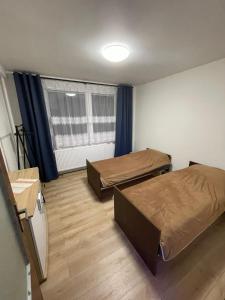 Postel nebo postele na pokoji v ubytování Apartmán Gerlach