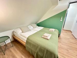 Ένα ή περισσότερα κρεβάτια σε δωμάτιο στο RP-Apartments