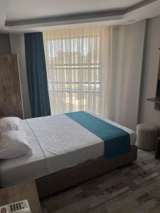 Postel nebo postele na pokoji v ubytování Tüm Palace Otel