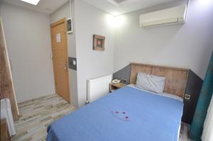 Postel nebo postele na pokoji v ubytování Tüm Palace Otel