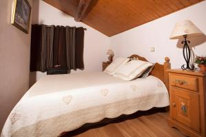 Postel nebo postele na pokoji v ubytování Chalet Le Refuge