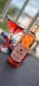 a bottle of alcohol sitting on top of a table at Livno Sympan in Livno