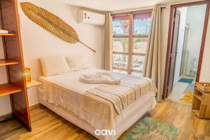 Postel nebo postele na pokoji v ubytování Qavi - Casa Palm Paradise #ParaisoDoBrasil + 31 fotografií