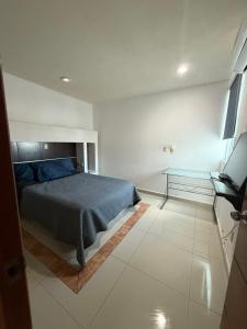 En eller flere senge i et værelse på Departamento Flor de Loto