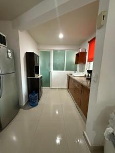 Køkken eller tekøkken på Departamento Flor de Loto + 2 billeder