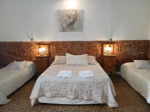 Postel nebo postele na pokoji v ubytování La Blanquita de Areco