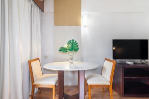 TV a/nebo společenská místnost v ubytování Akile LEONCIO