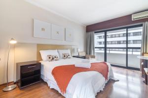 Postel nebo postele na pokoji v ubytování Akile LEONCIO