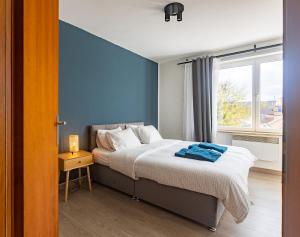 Ένα ή περισσότερα κρεβάτια σε δωμάτιο στο Moni 2D Residence