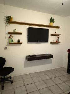 TV a/nebo společenská místnost v ubytování Casa Jardín