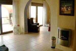 a living room with a couch and a fireplace at Marbella Guia Isora in Guía de Isora