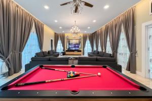 a red pool table in a living room at Luxury Villa Monterez Club Golf, Shah Alam - Smarthome in Shah Alam