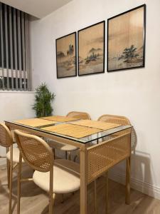 a dining room with a wooden table and chairs at Modern Refurbished Apt in Stevenage Town Centre in Stevenage
